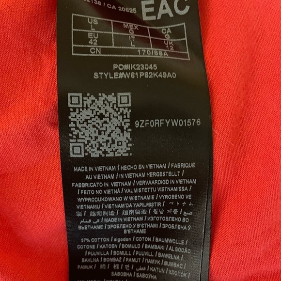 GUESS bright coral peplum blouse with an open back. Stretchy and soft! - Picture 2 of 5